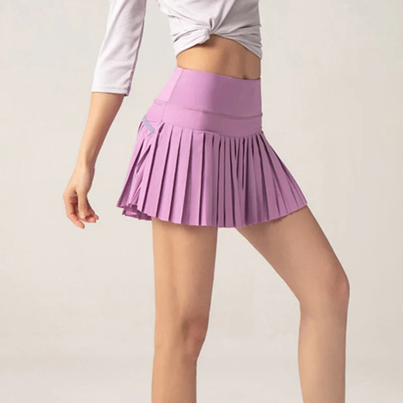 Onyx Flow Pleated Athletic Skirt – Built-In Shorts & Pockets